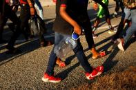 Migrants take part in a caravan heading to the U.S. border, near Tapachula