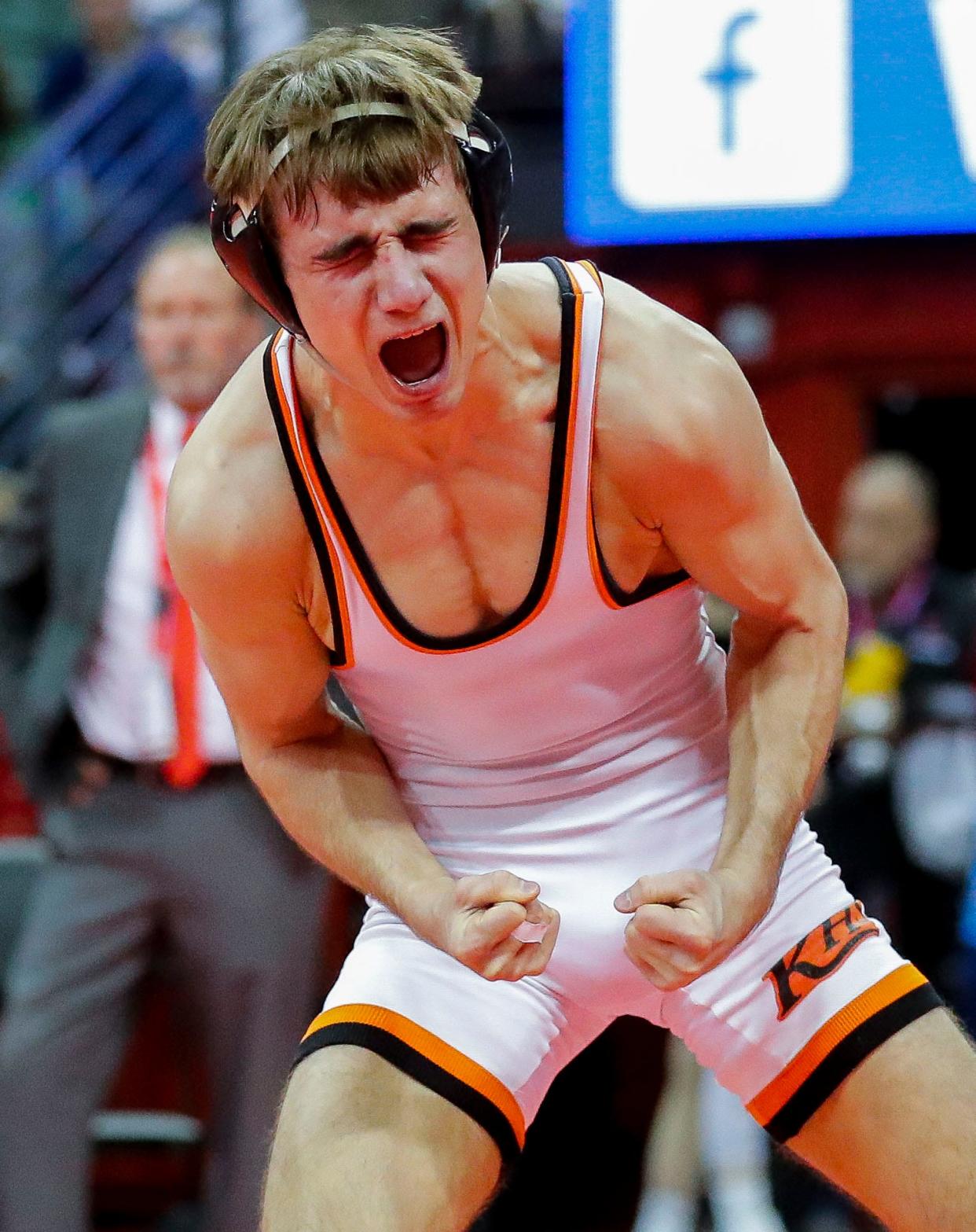 Kaukauna's Lucas Peters flexes after defeating Neenah's Jacob Herm in the Division 1 126-pound championship match during the WIAA individual state wrestling tournament Feb. 25 in Madison.