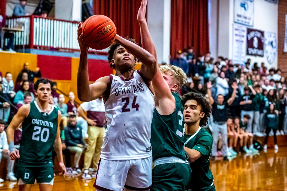 Bishop Stang's Sage Baptiste attacks the basket.