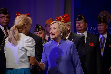 Democratic presidential nominee Hillary Clinton greets members of the audience following an address to the National Convention of the American Legion in Cincinnati, Ohio, U.S., August 31, 2016. REUTERS/Bryan Woolston