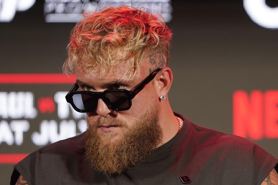 Jake Paul listens during a news conference promoting his upcoming fight against Mike Tyson, Thursday, May 16, 2024, in Arlington, Texas. The fight is scheduled for July 20. (AP Photo/Sam Hodde)