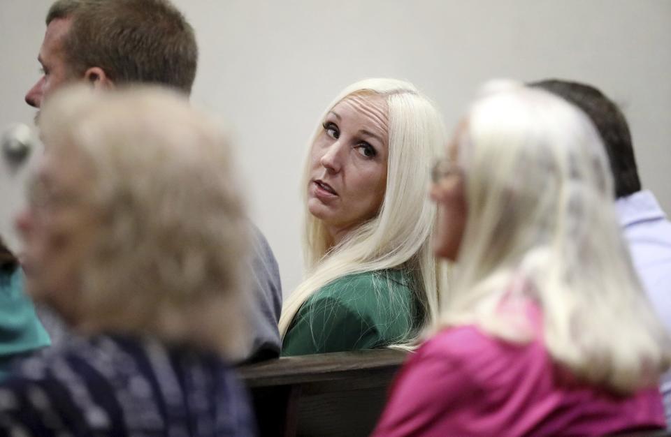 Nicole Oulson, widow of Chad Oulson, is seated in the gallery moments before former Tampa police captain Curtis Reeves is called to give testimony in his defense during his second-degree murder trial on Thursday, Feb 24, 2022, at the Robert D. Sumner Judicial Center in Dade City, Fla. Reeves is accused of shooting and killing Chad Oulson at a Wesley Chapel movie theater in January 2014. (Douglas R. Clifford/Tampa Bay Times via AP, Pool)