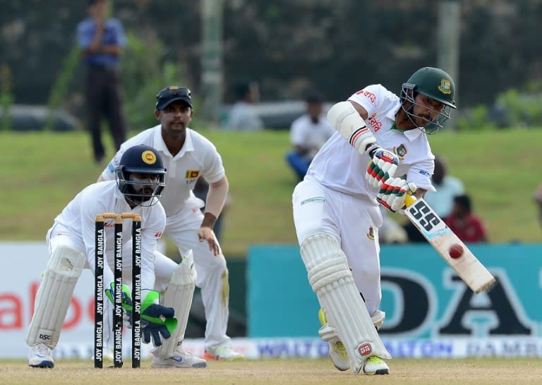Bangladesh batsman Soumya Sarkar (R) plays a shot as Sri Lanka wicketkeeper Niroshan Dickwella looks on during the fourth day of the first Test at the Galle International Cricket Stadium in Galle on March 10, 2017