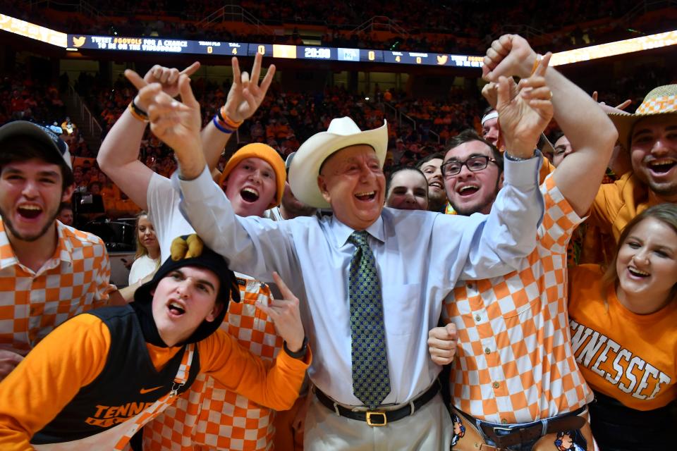 ESPNâ€™s Dick Vitale poses for photographs with the Rocky Top Rowdies before the start fo the basketball game between Tennessee and Memphis at Thompson-Boling Arena in Knoxville, Tenn., on Saturday, December 14, 2019.