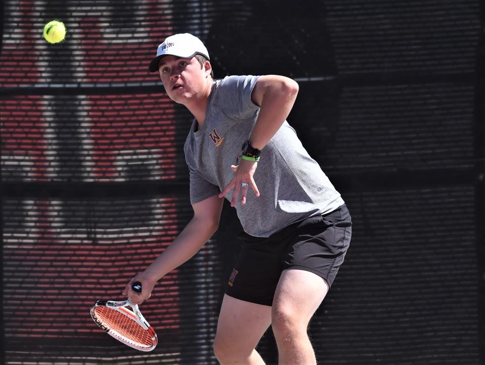 Wylie's Connor Brown prepares to return a shot against Fort Worth Arlington Heights' Evan Garza and Holman Harvey. Brown and Grant Bristow won the first-round boys doubles match 6-1, 6-0 at the Region I-5A tournament Monday at the McLeod Tennis Center in Lubbock.