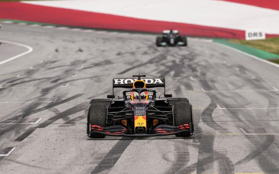 Dutch Formula One driver Max Verstappen (front) of Red Bull Racing and British Formula One driver Lewis Hamilton of Mercedes-AMG Petronas arrive at parc ferme after the Formula One Grand Prix of Styria at the Red Bull Ring in Spielberg, Austria, 27 June 2021 - Shutterstock