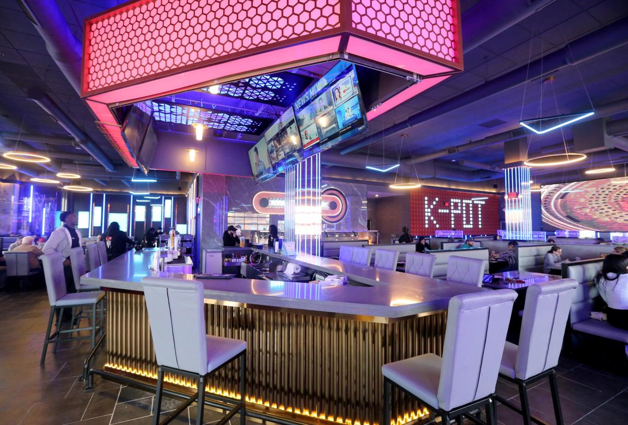 A bar is near the dining area Thursday, March 14, 2024, at KPot Korean BBQ and Hot Pot restaurant at University Park Mall in Mishawaka.