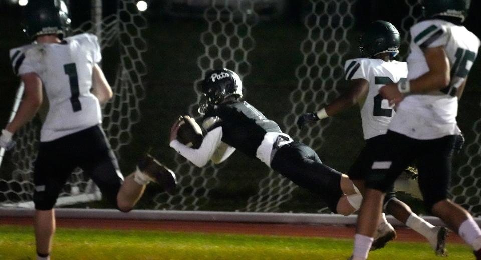 Pilgrim receiver Jack Coffey makes a diving catch for a touchdown in the second half of Thursday's game against Ponaganset.