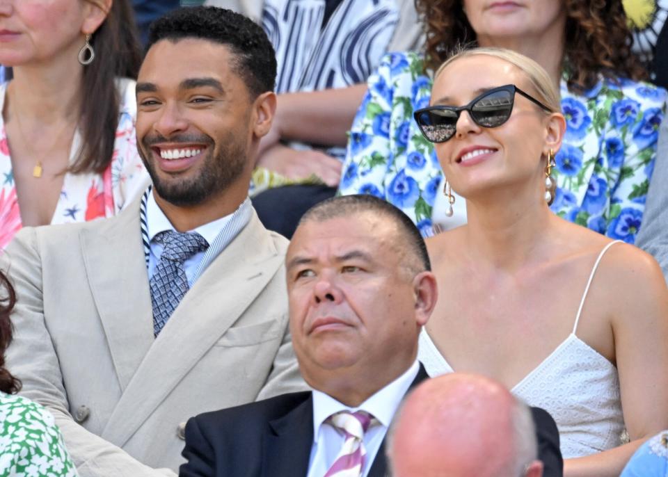 Regé-Jean Page, Emily Brown and Professor Sir Jonathan Van-Tam attend day 12 of the Wimbledon Tennis Championships at All England Lawn Tennis and Croquet Club on July 08, 2022 in London, England.