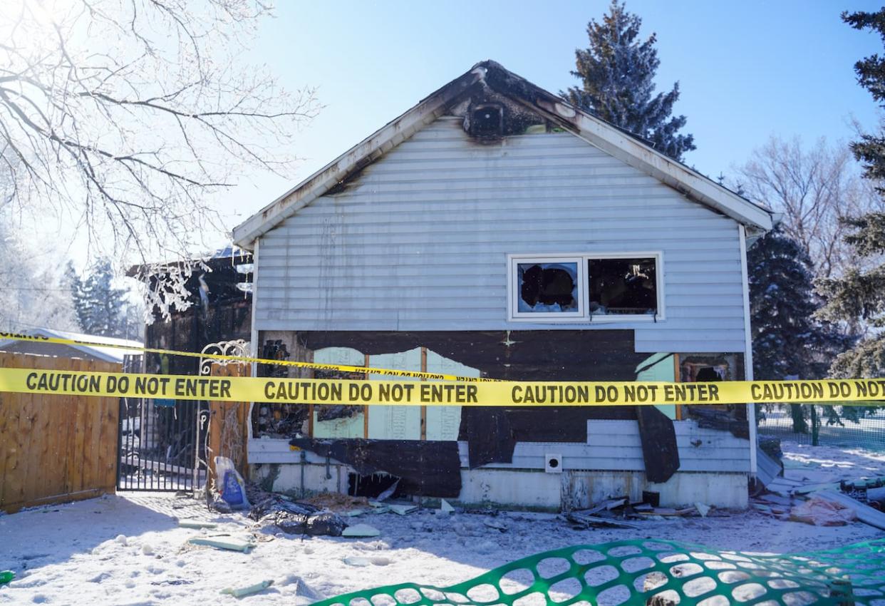 The scene of a house fire that happened on Ottawa Street in Davidson, Sask., Sunday, Feb. 18, 2024.  The fire claimed the lives of five people, including three children, according to the RCMP.  (Heywood Yu/The Canadian Press - image credit)