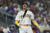 San Diego Padres' Juan Soto reacts after a swinging strike during the seventh inning of the team's baseball game against the Los Angeles Dodgers, Thursday, Sept. 29, 2022, in San Diego. (AP Photo/Gregory Bull)