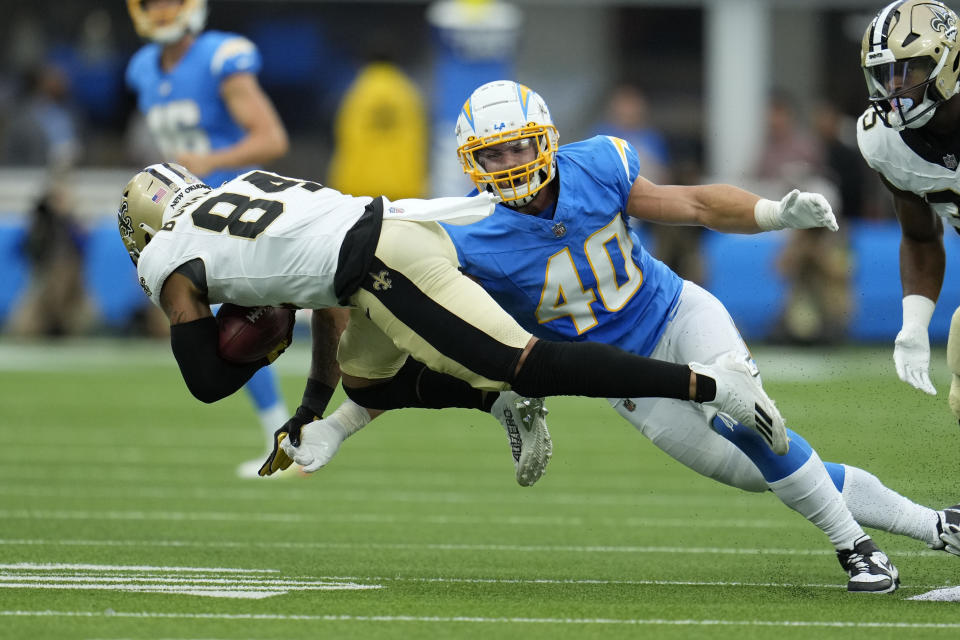 New Orleans Saints wide receiver Lynn Bowden (84) is tackled by Los Angeles Chargers fullback Zander Horvath (40) on a punt return in the first half of an NFL football game in Inglewood, Calif., Sunday, Aug. 20, 2023. (AP Photo/Marcio Jose Sanchez)