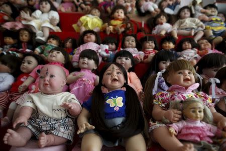 "Child angel" dolls are pictured at a house that sell the dolls in Nonthaburi, Thailand, January 26, 2016. REUTERS/Athit Perawongmetha