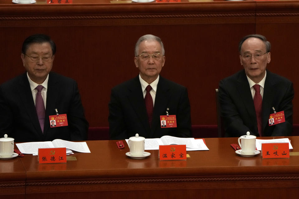 From left, Zhang Dejiang, former Premier Wen Jiabao, and Wang Qishan attend the closing ceremony of the 20th National Congress of China's ruling Communist Party at the Great Hall of the People in Beijing, Saturday, Oct. 22, 2022. (AP Photo/Ng Han Guan)
