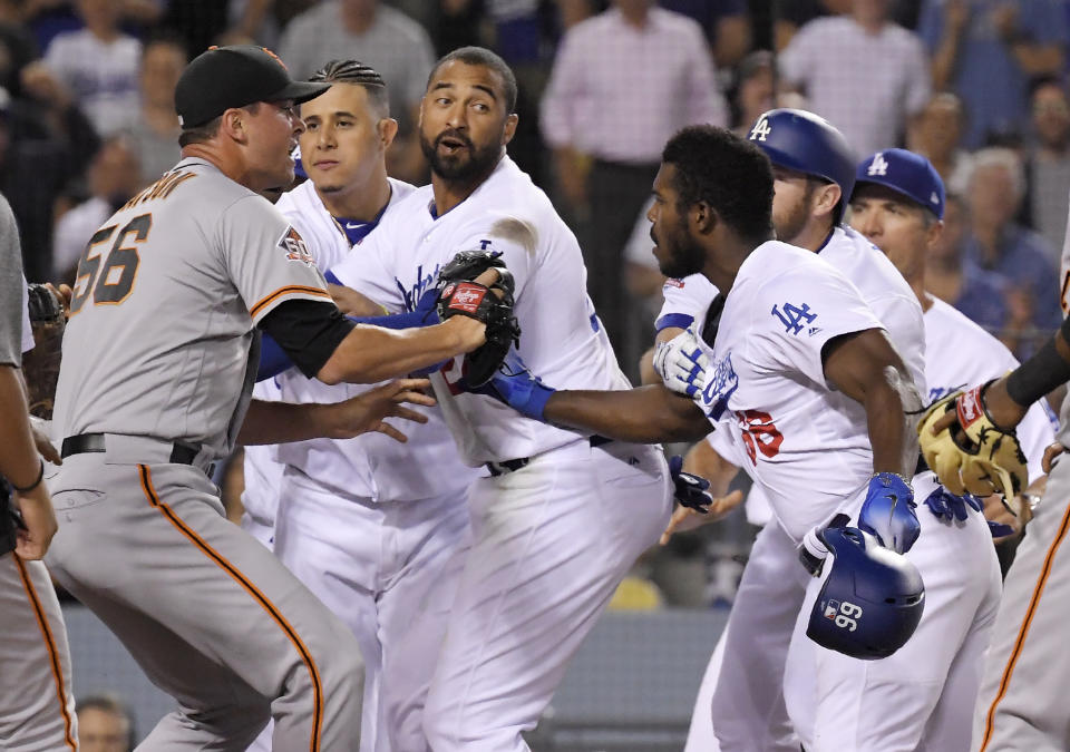 Los Angeles Dodgers outfielder Yasiel Puig (front right) was suspended for his role in Tuesday's brawl with the San Francisco Giants. (AP)