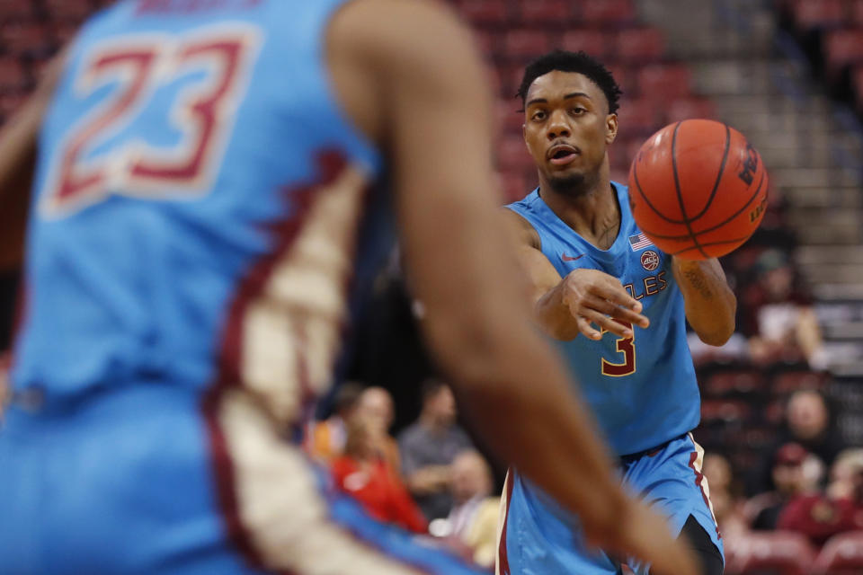 Florida State guard Trent Forrest (3) passes to guard M.J. Walker (23) in the first half of an NCAA college basketball game against South Florida, part of the Orange Bowl Classic tournament, Saturday, Dec. 21, 2019, in Sunrise, Fla. (AP Photo/Wilfredo Lee)