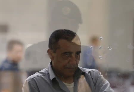 A Yemeni man entering Saudi Arabia waits to stamp his passport at Al-Tiwal crossing in Jizan on Saudi Arabia's border with Yemen, April 7, 2015. REUTERS/Faisal Al Nasser