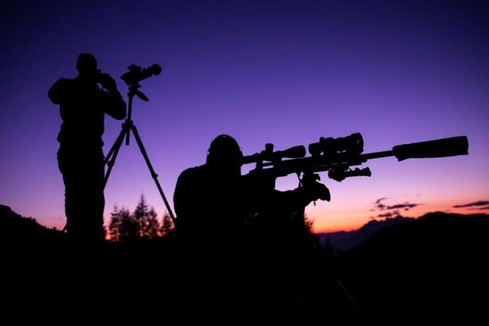 Greek Special Forces Snipers adjust their equipment for night time shooting