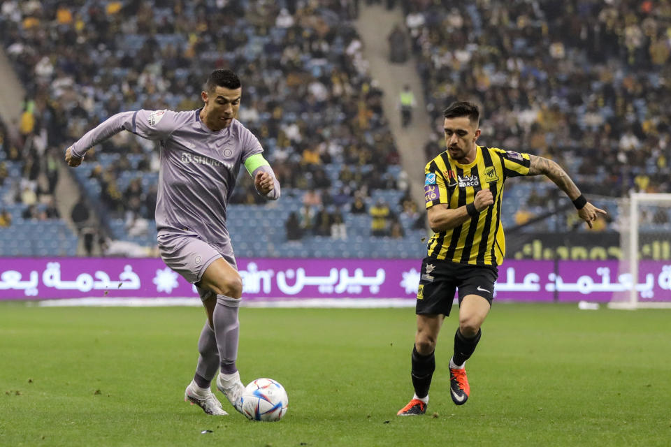 RIYADH, SAUDI ARABIA - JANUARY 26: Cristiano Ronaldo (L) of Al Nassr in action during the Saudi Super Cup Semi-Final football match between Al Ittihad and Al Nassr at King Fahd International Stadium in Riyadh, Saudi Arabia on January 26, 2023. (Photo by Noor Abdelfatah/Anadolu Agency via Getty Images)