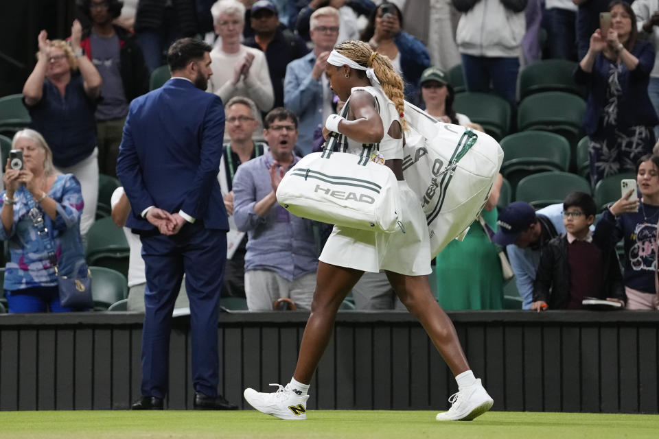 Coco Gauff of the United States leaves Centre Court following her fourth round loss to compatriot Emma Navarro at the Wimbledon tennis championships in London, Sunday, July 7, 2024. (AP Photo/Alberto Pezzali)