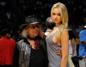 <p>Amalie Wichmann poses with James Goldstein during the 2011 NBA Playoffs in 2011. </p>