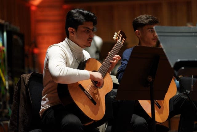 Afghan Youth Orchestra guitarist performs