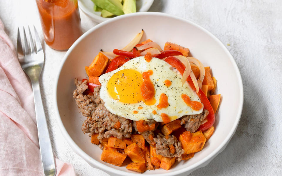 <p>Teresa Blackburn</p><p>A healthier version of the classic egg, bacon and potato breakfast, this bowl features sweet potatoes, sauteed peppers and onions, turkey sausage and a fried egg. </p><p><strong>Get the recipe: <a href="https://parade.com/1282461/parade/sweet-potato-sausage-breakfast-bowls/" rel="nofollow noopener" target="_blank" data-ylk="slk:Sweet Potato and Sausage Breakfast Bowl;elm:context_link;itc:0;sec:content-canvas" class="link ">Sweet Potato and Sausage Breakfast Bowl</a></strong></p>