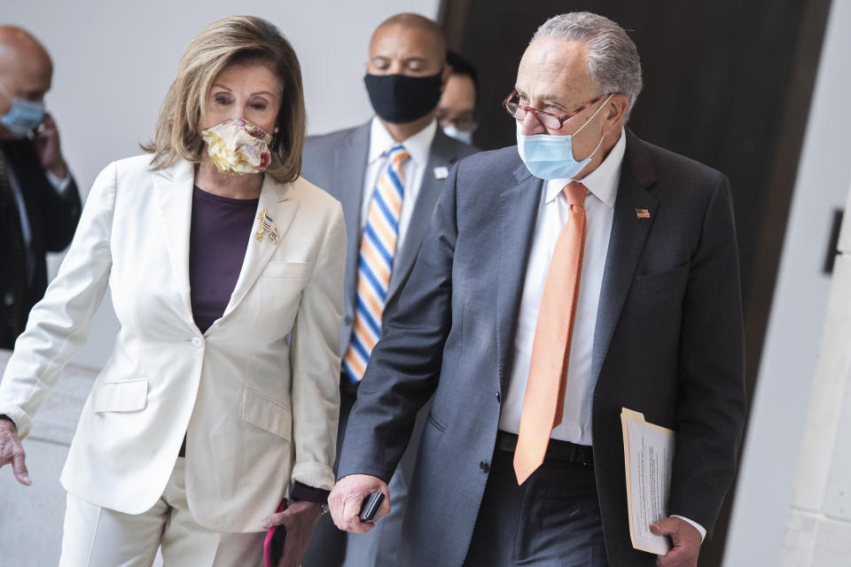 UNITED STATES - AUGUST 06: Speaker Nancy Pelosi, D-Calif., and Senate Minority Leader Charles Schumer, D-N.Y., make their way to a news conference on coronavirus aid in the Capitol Visitor Center on Thursday, August 6, 2020. (Photo By Tom Williams/CQ-Roll Call, Inc via Getty Images)