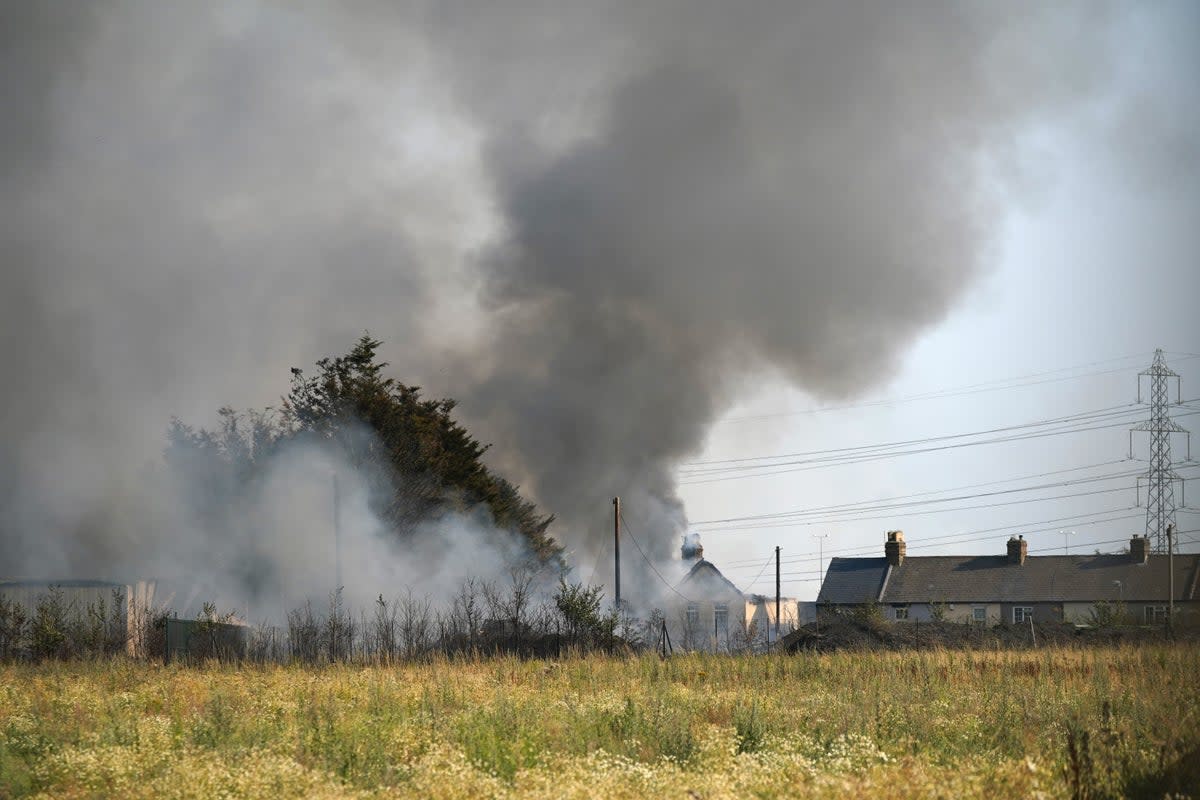 The scene of a blaze in the village of Wennington, sparked by the heatwave (Yui Mok/PA) (PA Wire)