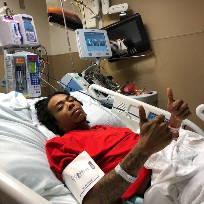 DeMitrious Wyant, who was born with sickle cell disease, gives the thumbs-up while receiving a blood transfusion at AdventHealth Orlando hospital in Orlando, Fla., on Wednesday, Jan. 30, 2019, when he was 31. “When you’re getting an exchange transfusion … you can tell that you’re being stripped of blood and getting different blood put in," he told the USA TODAY Network–Florida in July 2021.