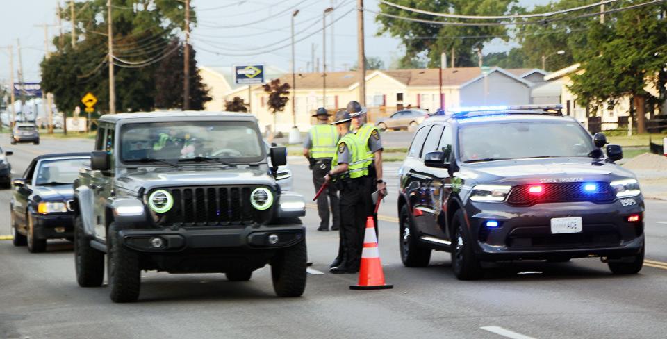 Law enforcement conducted an OVI checkpoint on Claremont Avenue in Ashland on Friday. About 300 vehicle drivers were checked for impairment.