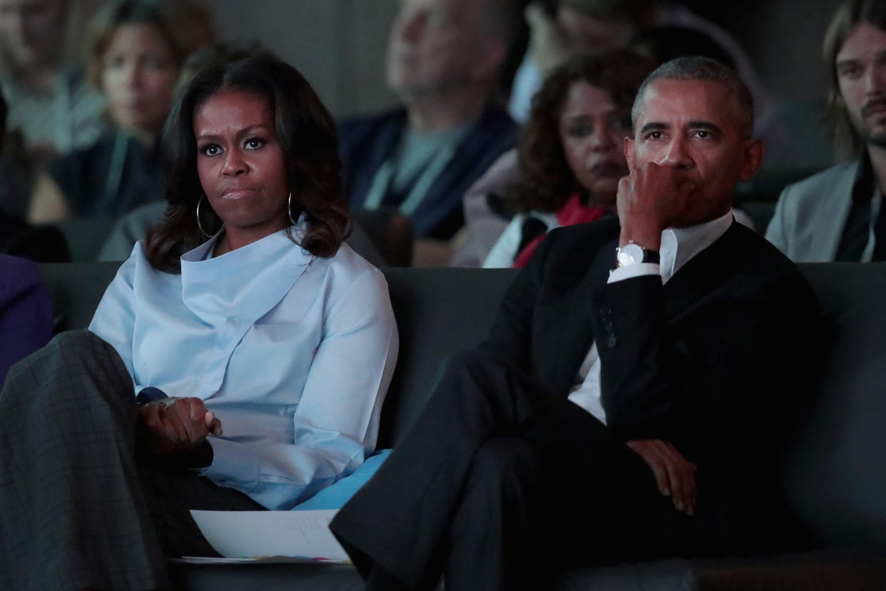 CHICAGO, IL - OCTOBER 31:  Former first Lady Michelle and former president Barack Obama listen to speakers at the inaugural Obama Foundation Summit on October 31, 2017 in Chicago, Illinois. The  two-day event will feature a mix of community leaders politicians and artists exploring creative solutions to common problems, and experiencing art, technology, and music from around the world.  (Photo by Scott Olson/Getty Images)