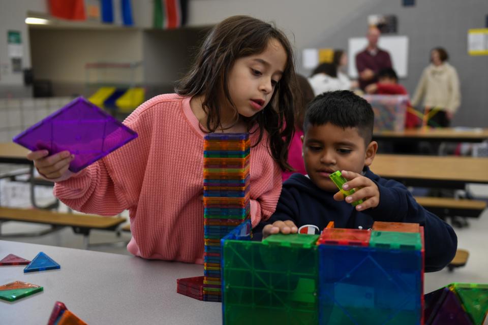 Two students work together to build a house on Wednesday, Nov. 8, 2023 at Terry Redlin Elementary School in Sioux Falls, South Dakota.
