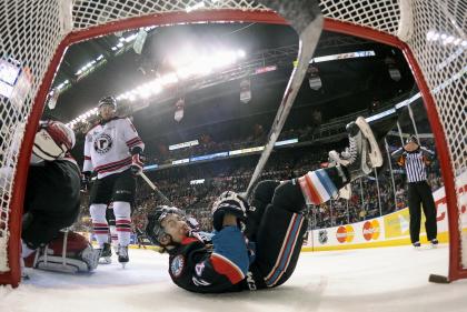 Kelowna Rockets Tyson Baillie bites his shirt after falling into the net during the first period of their semi-final Memorial Cup hockey game at the Colisee Pepsi in Quebec City, May 29, 2015. REUTERS/Jacques Boissinot/Pool