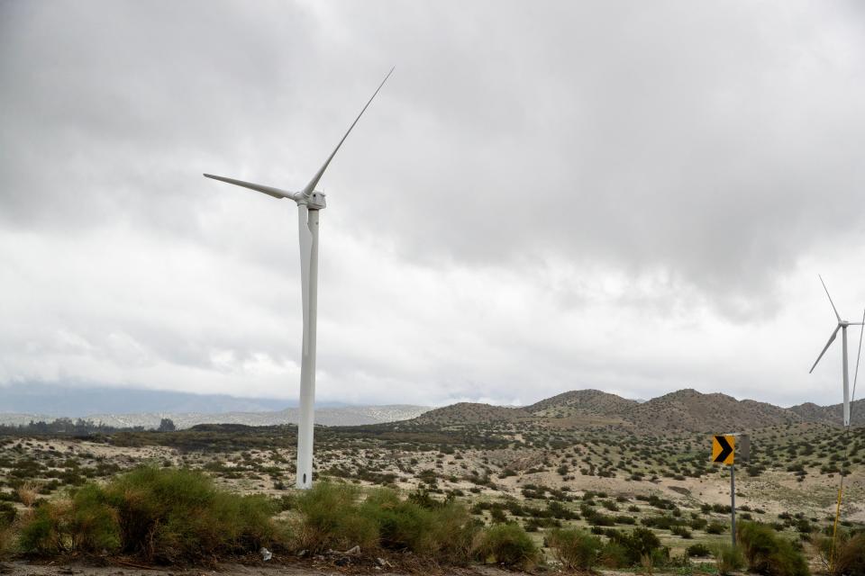 Clouds loomed in the distance as rain fell near a windmill in the Coachella Valley on Thursday.