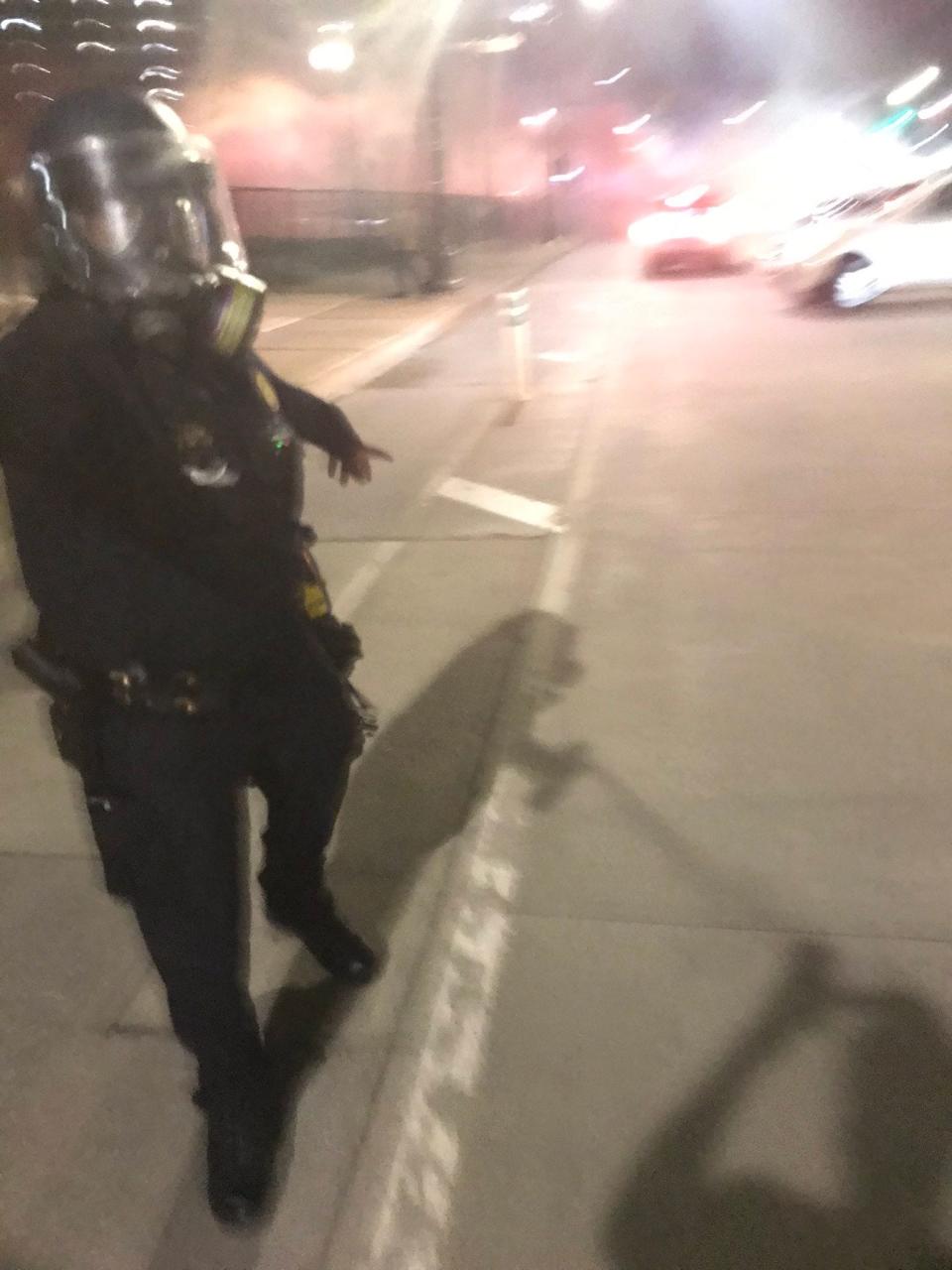 A Detroit police officer maces Detroit Free Press reporter JC Reindl while he shoots photos of protests that turned contentious late on Saturday, May 31, 2020.