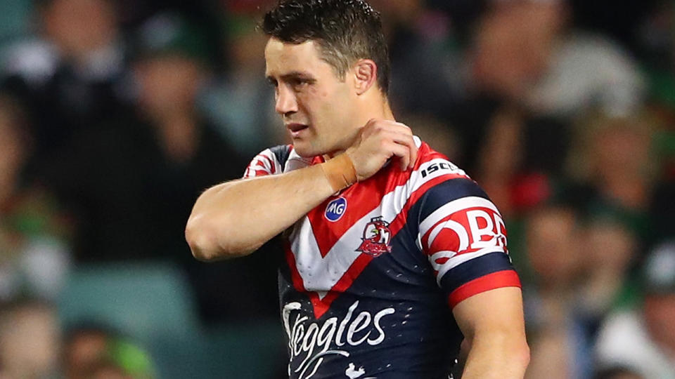 Cooper Cronk holds his shoulder during the NRL Preliminary Final. (Photo by Cameron Spencer/Getty Images)