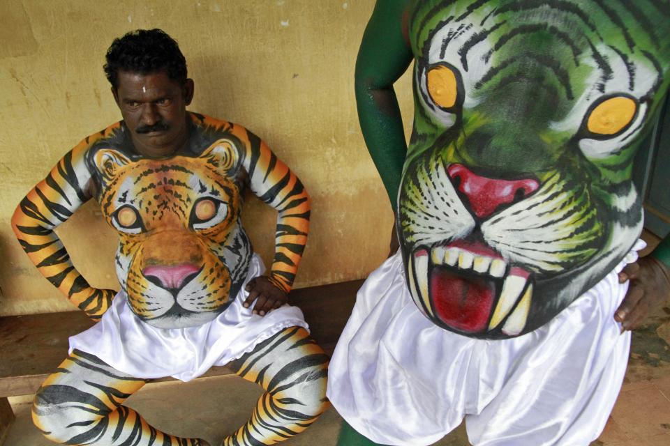 Dancers in body paint wait to take part in a performance during festivities marking the start of the annual harvest festival of "Onam" in the southern Indian city of Kochi September 7, 2013. The ten-day-long Hindu festival is celebrated annually in India's southern coastal state of Kerala to commemorate the return of King Mahabali to his beloved subjects. (REUTERS/Sivaram V)