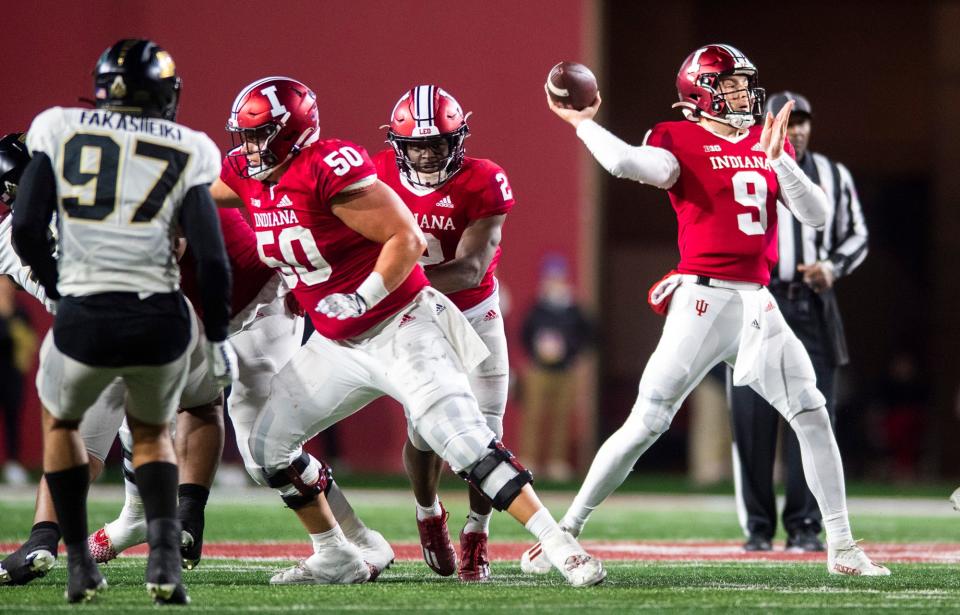 Indiana's Connor Bazelak (9) throws the pass during the second half of the Indiana versus Purdue football game at Memorial Stadium on Saturday, Nov. 26, 2022.