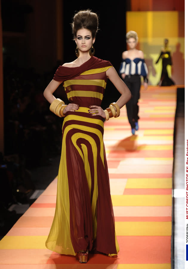 <b>Jean Paul Gaultier SS13 </b><br><br>Sailor stripes were a key trend on the catwalk with this model donning a dress in brown and mustard shades.<br><br>© Rex