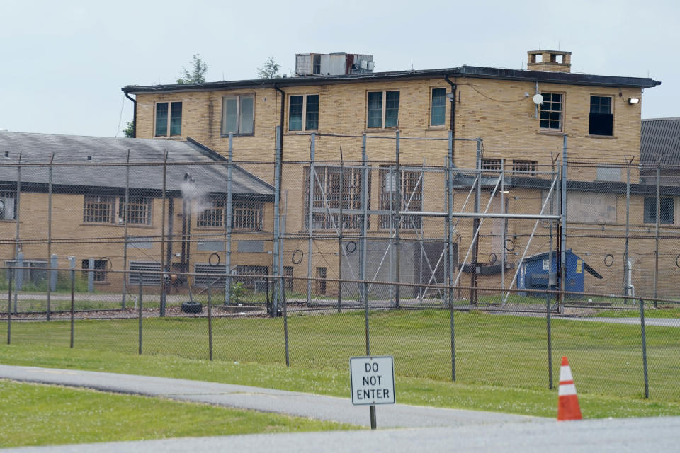 High fences surround buildings on the grounds of the Edna Mahan Correctional Facility for Women in Clinton, N.J., Tuesday, June 8, 2021. New Jersey's embattled corrections commissioner announced his resignation Tuesday, a day after Gov. Phil Murphy said the state would shutter its long-troubled and only women's prison. (AP Photo/Seth Wenig)