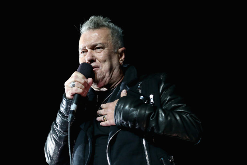 Jimmy Barnes singing on stage. 