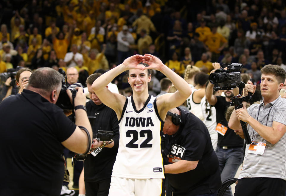 IOWA CITY, IOWA- MARCH 25: Guard Caitlin Clark #22 of the Iowa Hawkeyes gestures to the crowd as she leaves the court after the game against the West Virginia Mountaineers during their second round match-up in the 2024 NCAA Division 1 Women's Basketball Championship at Carver-Hawkeye Arena on March 25, 2024 in Iowa City, Iowa. (Photo by Matthew Holst/Getty Images)