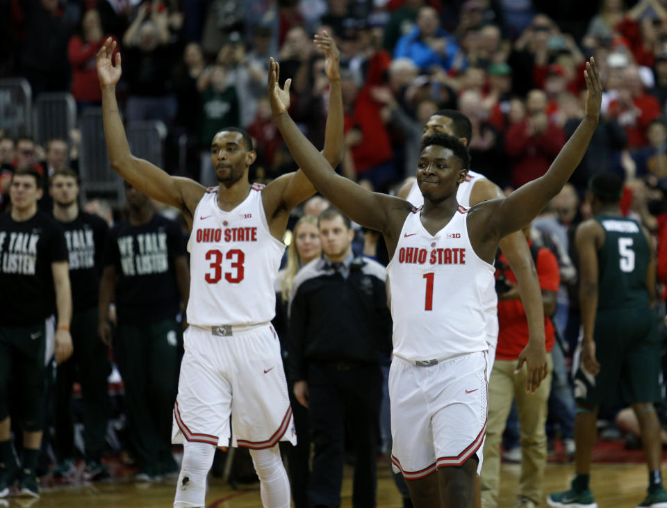 Ohio State forward Keita Bates-Diop, left, and forward Jae’Sean Tate celebrate following their NCAA college basketball game win over Michigan State in Columbus, Ohio, Sunday, Jan. 7, 2018. (AP Photo/Paul Vernon)