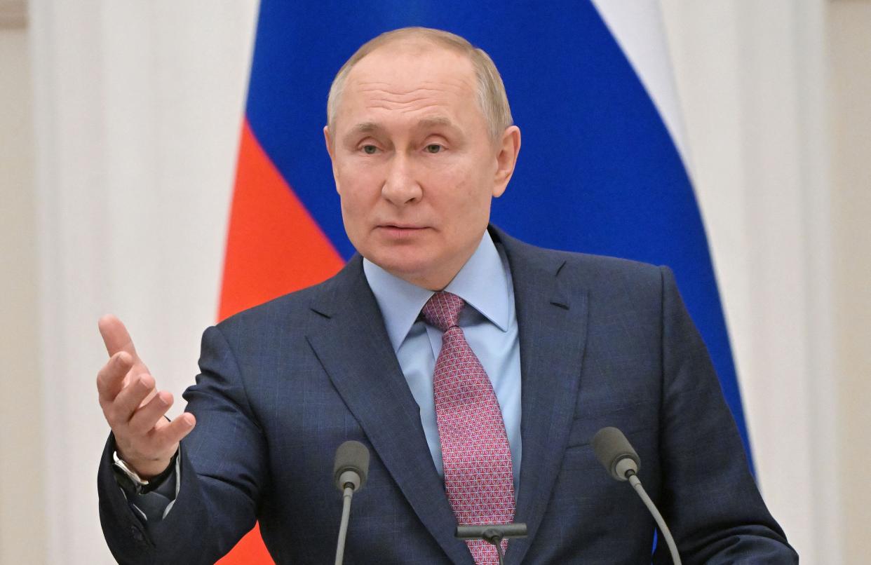 Vladimir Putin speaks during a press conference.