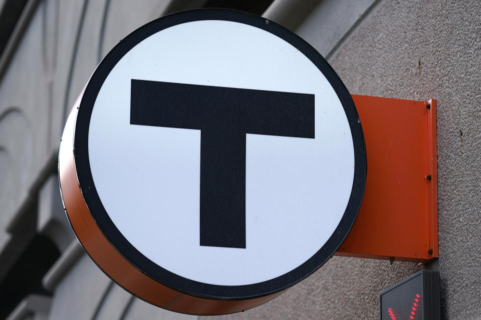 The "T" logo marks the passenger parking garage adjacent to the Orange Line's Wellington Station, Wednesday, July 13, 2022, in Medford, Mass. Boston's public transit system is a mess, harried commuters and officials are increasingly looking to a Chinese-owned subway car manufacturer to account for some of the troubles. There have been fatal accidents, subway car collisions, malfunctioning elevators, and trains running on weekend schedules during rush hour. (AP Photo/Charles Krupa)