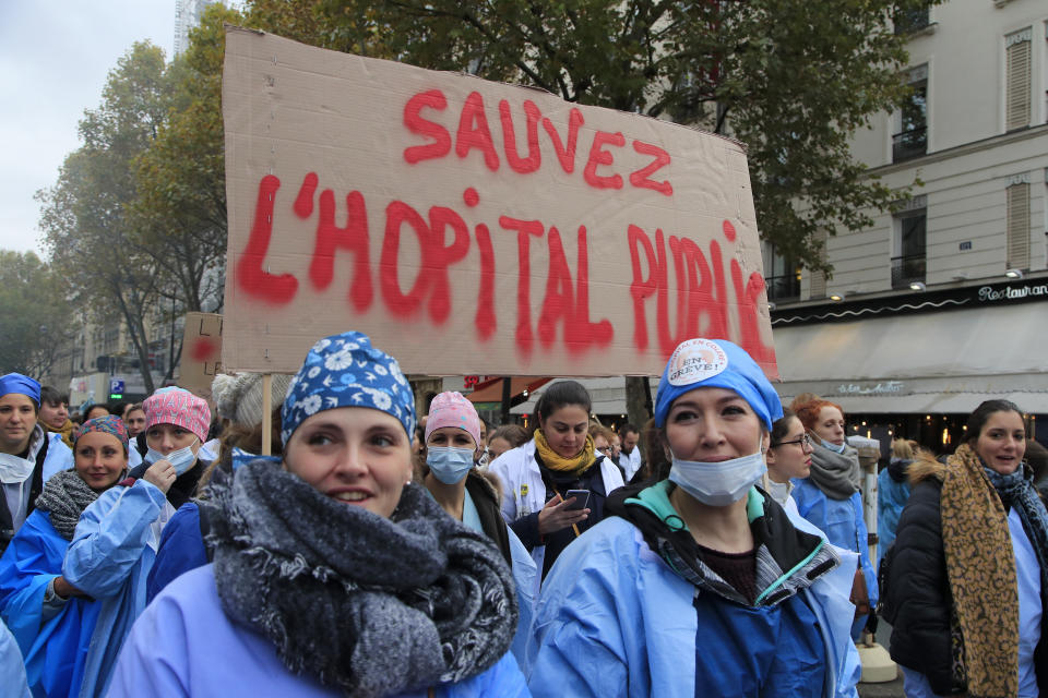 Nurses march during a national demonstration Thursday, Nov. 14, 2019 in Paris. Thousands of exasperated nurses, doctors and other public hospital workers are marching through Paris to demand more staff and resources after years of cost cuts. (AP Photo/Michel Euler)