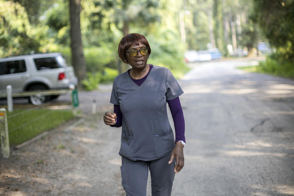 Queen Davis walks down Allen Road, Tuesday, July 18, 2023, in Hilton Head Island, S.C. Davis now faces the prospect of losing about 11 acres after a June judicial order that would place a portion on the market for $7 million. (AP Photo/Stephen B. Morton)