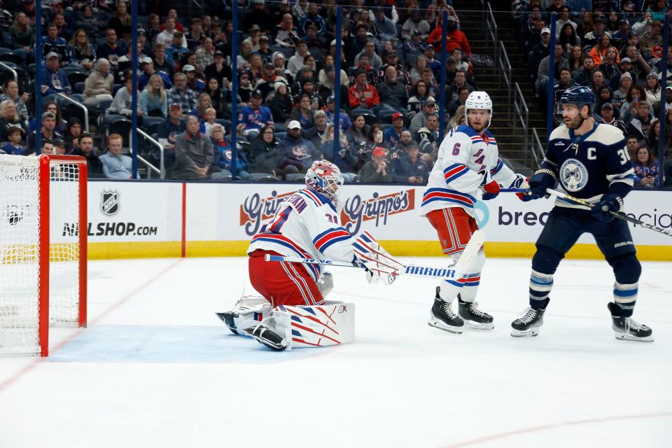 COLUMBUS, OHIO - OCTOBER 14: Boone Jenner #38 of the Columbus Blue Jackets watches as his shot beats Igor Shesterkin #31 of the New York Rangers for his third goal of the night during the second period of the game at Nationwide Arena on October 14, 2023 in Columbus, Ohio.