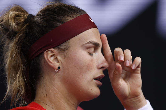 Aryna Sabalenka of Belarus reacts as she leaves the court following her fourth round loss to Kaia Kanepi of Estonia at the Australian Open tennis championships in Melbourne, Australia, early Tuesday, Jan. 25, 2022. (AP Photo/Hamish Blair)